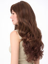 Model is wearing WENDI by ENVY in color CINNAMON-RAISIN | Medium Brown with Auburn and Cinnamon highlights