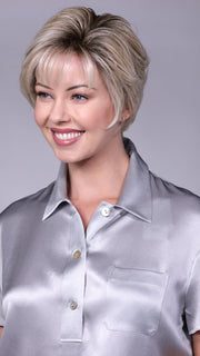 Model is wearing WILLIAMSBURG By BELLETRESS in CRUSHED-ALMOND-BLONDE-R | A Soft Neutral Light Blonde with a Light and Medium Blended Root Color