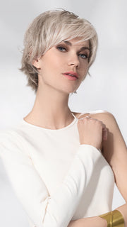 Model is wearing AVENUE SOFT by ELLEN WILLE in color SNOW MIX 60.56.58 | Pearl White, Lightest Blonde, and Black/Dark Brown with Grey Blend