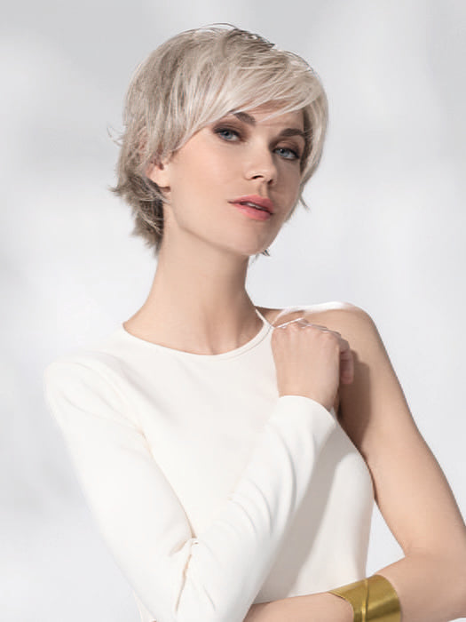Model is wearing AVENUE SOFT by ELLEN WILLE in color SNOW MIX 60.56.58 | Pearl White, Lightest Blonde, and Black/Dark Brown with Grey Blend