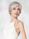 Model is wearing AVENUE SOFT by ELLEN WILLE in color SNOW MIX 60.56.58 | Pearl White, Lightest Blonde, and Black/Dark Brown with Grey Blend