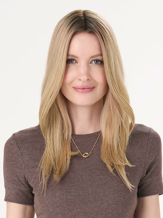 Model is wearing BARELY THERE STRAIGHT TOPPER in color VANILLA LATTE (17/101R8) | Rooted medium Blonde with Cool Platinum Dimension