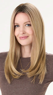 Model is wearing BARELY THERE STRAIGHT TOPPER in color VANILLA LATTE (17/101R8) | Rooted medium Blonde with Cool Platinum Dimension