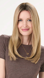 Model is wearing BARELY THERE STRAIGHT TOPPER in color VANILLA LATTE (17/101R8) | Rooted medium Blonde with Cool Platinum Dimension