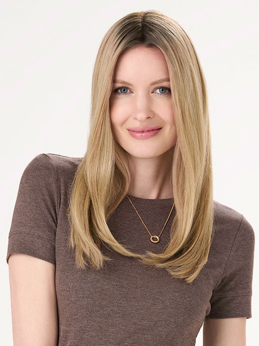 Model is wearing BARELY THERE STRAIGHT TOPPER in color VANILLA LATTE (17/101R8) | Rooted medium Blonde with Cool Platinum Dimension