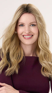 Model is wearing BARELY THERE WAVY 16" in color VANILLA LATTE (17/101R8) | Rooted medium Blonde with Cool Platinum Dimension