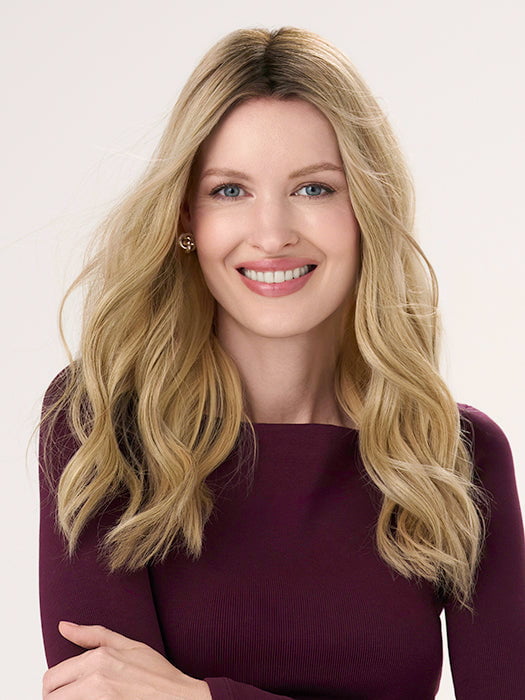 Model is wearing BARELY THERE WAVY 16" in color VANILLA LATTE (17/101R8) | Rooted medium Blonde with Cool Platinum Dimension