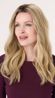 Model is wearing BARELY THERE WAVY 16" in color VANILLA LATTE (17/101R8) | Rooted medium Blonde with Cool Platinum Dimension