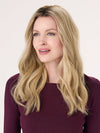 Model is wearing BARELY THERE WAVY 16" in color VANILLA LATTE (17/101R8) | Rooted medium Blonde with Cool Platinum Dimension
