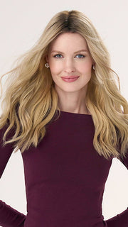 Model is wearing BARELY THERE WAVY 16" in color VANILLA LATTE (17/101R8) | Rooted medium Blonde with Cool Platinum Dimension