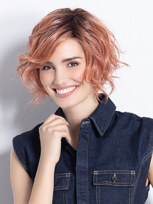 Model is in ROSE BLUSH ROOTED | Light copper, Peach, and Soft Rose Gold tones with subtle Golden Undertones and Shaded Roots