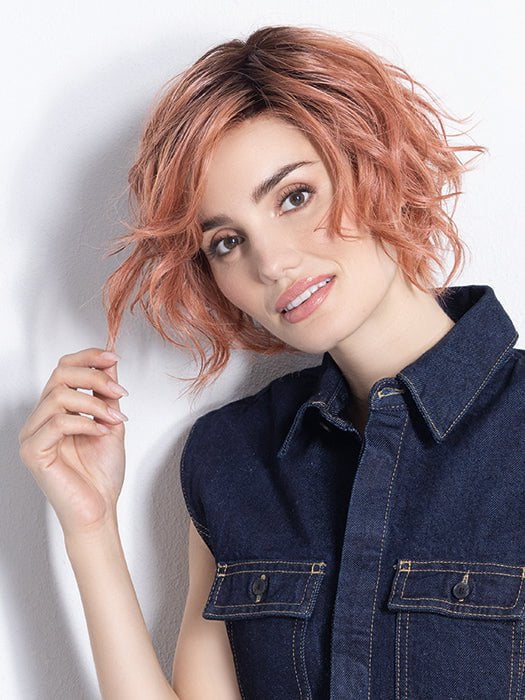 Model is in ROSE BLUSH ROOTED | Light copper, Peach, and Soft Rose Gold tones with subtle Golden Undertones and Shaded Roots