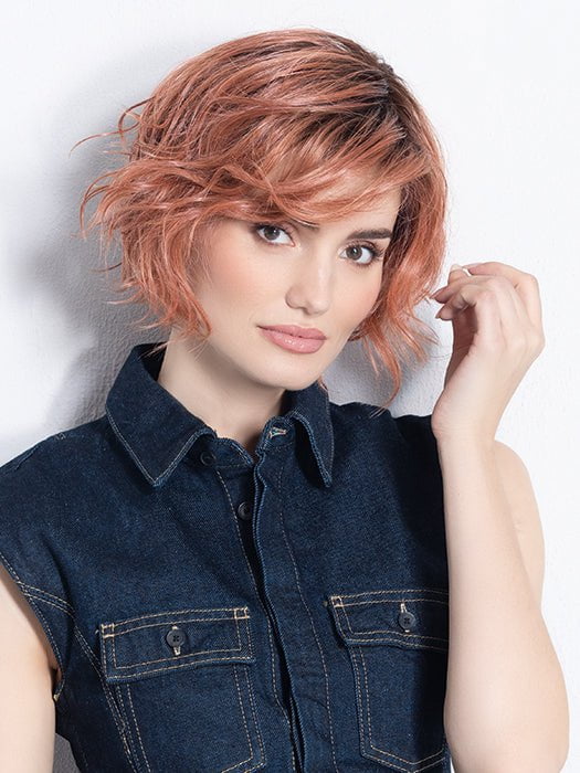 Model is in ROSE BLUSH ROOTED | Light copper, Peach, and Soft Rose Gold tones with subtle Golden Undertones and Shaded Roots