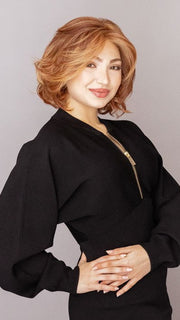 Maha is wearing CROWD PLEASER by RAQUEL WELCH in color RL31/29 FIERY COPPER | Medium Light Auburn Evenly Blended with Ginger Blonde