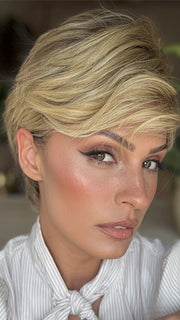Roxie is wearing DEMI by JON RENAU in color 12FS8 SHADED PRALINE | Medium Natural Gold Blonde, Light Gold Blonde, Pale Natural Blonde Blend, Shaded with Dark Brown