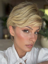 Roxie is wearing DEMI by JON RENAU in color 12FS8 SHADED PRALINE | Medium Natural Gold Blonde, Light Gold Blonde, Pale Natural Blonde Blend, Shaded with Dark Brown