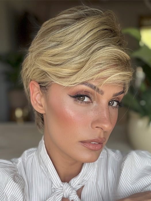 Roxie is wearing DEMI by JON RENAU in color 12FS8 SHADED PRALINE | Medium Natural Gold Blonde, Light Gold Blonde, Pale Natural Blonde Blend, Shaded with Dark Brown