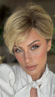 Roxie is wearing DEMI by JON RENAU in color 12FS8 SHADED PRALINE | Medium Natural Gold Blonde, Light Gold Blonde, Pale Natural Blonde Blend, Shaded with Dark Brown