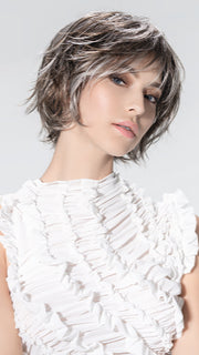 Model is wearing ESCAPE SOFT by ELLEN WILLE in color SMOKE FROSTED 38.36.60 | Light Brown and Medium Brown with Pearl White and Grey Blend with a Soft Matte Finish