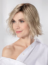 Model is wearing ESPRIT SOFT SMALL by ELLEN WILLE in color PEARL BLONDE ROOTED | Pearl Platinum and Lightest Ash Blonde with Medium Ash Blonde Blend and Shaded Roots