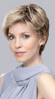 This cute pixie has wispy bangs you can style to the side
