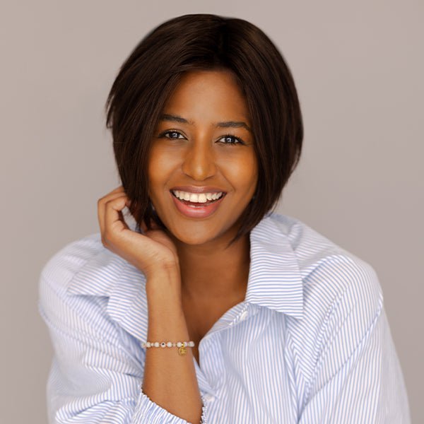 Book a free virtual consultation with a member of our client care team. Image: Woman in black dress wearing Drive by Ellen Wille.