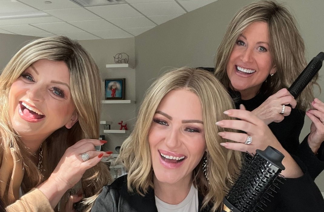 Wig ambassadors styling their wigs with Envy's 3-in-1 Airstyler.