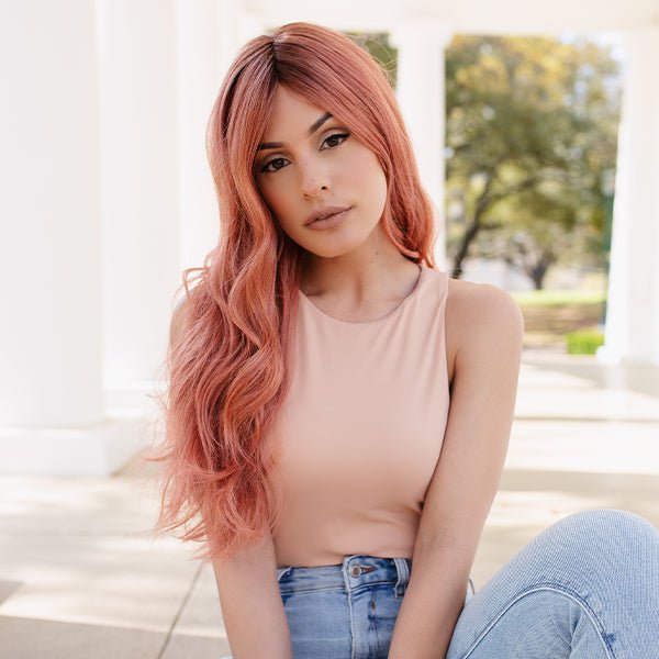 An example of rose gold hair in our wig Lavish Wavez by Rene of Paris in Dusty Rose.