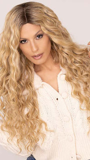 Roxie wearing CURLY GIRLIE by HAIRDO in color SS25 SHADED GINGER BLONDE | Golden Blonde with Subtle Highlights and Medium Brown Roots