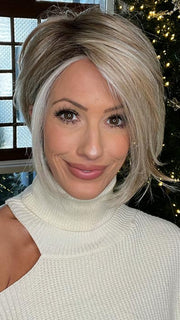 Jenna Fail in BOUDOIR GLAM by RAQUEL WELCH in color RL19/23SS SHADED BISCUIT | Light Ash Blonde Evenly Blended with Cool Platinum Blonde with Dark Roots