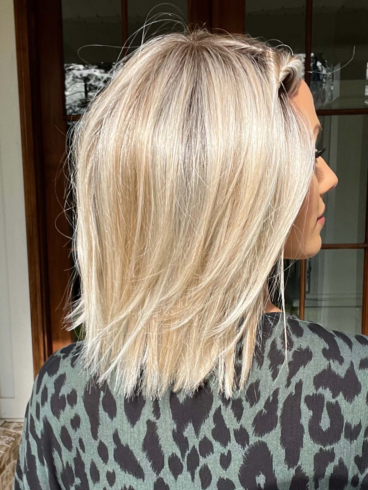 Jenna Fail @jenna_fail wearing UPSTAGE (straightened at the ends) by RAQUEL WELCH WIGS in color RL19/23SS SHADED BISCUIT | Light Ash Blonde Evenly Blended with Cool Platinum Blonde with Dark Roots
