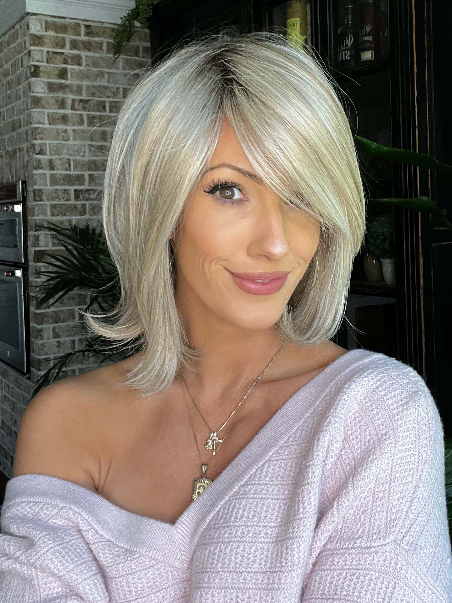 Jenna Fail @jenna_fail wearing UPSTAGE by RAQUEL WELCH WIGS in color RL19/23SS SHADED BISCUIT | Light Ash Blonde Evenly Blended with Cool Platinum Blonde with Dark Roots