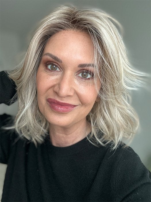 Emily H. @she_sheds_more wearing LORYN by RENE OF PARIS in shade SEA-SALT-BLOND-R | A perfect mixture of cool, icy-blond and warm-dark blond. The rich brown root tone enhances the modern appearance