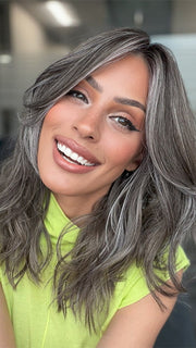 Model is wearing MAUDE by AMORE in color MUSHROOM-GREY-R |  Dark brown incorporates light brown and silvery grey tones with shadow roots for a stylish finish.