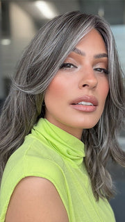 Model is wearing MAUDE by AMORE in color MUSHROOM-GREY-R |  Dark brown incorporates light brown and silvery grey tones with shadow roots for a stylish finish.
