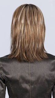 Model is wearing SAND MULTI ROOTED 14.24.12 | Medium Ash Blonde, Lightest Ash Blonde, and Lightest Brown Blend with Dark Shaded Roots