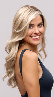 Model is wearing AMBER by JON RENAU in color 101/88/27S8 CATALINA BLONDE | Pale blonde with Pure White Natural Violet halo highlights, shaded medium brown