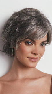 Model is wearing ASHA by RENE OF PARIS in MOONLIT SILK | A dark gray tone that features a multitude of metallic shades running throughout