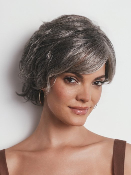 Model is wearing ASHA by RENE OF PARIS in MOONLIT SILK | A dark gray tone that features a multitude of metallic shades running throughout