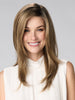 Model is wearing BELINDA HAND TIED by ENVY in color HONEY BREEZE | A blend of Cool, Honey Blonde and Multi-Dimensional Medium Brown with Darker Brown Roots