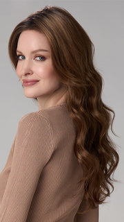 Model is wearing BRIANNA HAND TIED by ENVY in color CINNAMON TOFFEE | Neutral to Warm Light Brown with Dark Brown Roots
