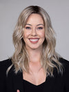 Model is wearing CAMPBELL by BELLETRESS in color BUTTERBEER R | Dark Brown Base and Root that transitions smoothly into a buttery blonde, infused with creamy honey and toffee tones