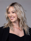 Model is wearing CAMPBELL by BELLETRESS in color BUTTERBEER R | Dark Brown Base and Root that transitions smoothly into a buttery blonde, infused with creamy honey and toffee tones