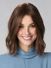 Model is wearing CHARLOTTE HAND TIED by ENVY in color MEDIUM BROWN | Medium Brown with natural highlights