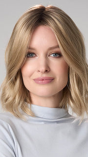 Model is wearing CHARLOTTE HAND TIED by ENVY in color PROSECCO (12/24/102R8)| Rooted Neutral Light Medium Blonde