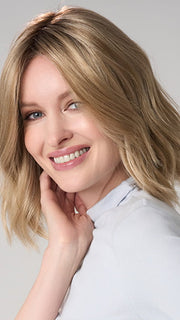Model is wearing CHARLOTTE HAND TIED by ENVY in color PROSECCO (12/24/102R8)| Rooted Neutral Light Medium Blonde