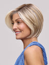 Model is wearing EVE by JON RENAU in color 101/88/27S8 CATALINA BLONDE | Pale blonde with Pure White Natural Violet halo highlights, shaded medium brown