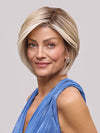 Model is wearing EVE by JON RENAU in color 101/88/27S8 CATALINA BLONDE | Pale blonde with Pure White Natural Violet halo highlights, shaded medium brown