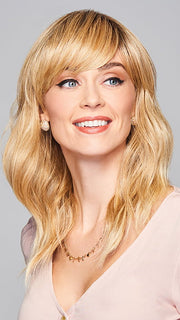 Model is wearing ASPIRATION by GABOR in color SS-LIGHT-BLONDE | Light Blonde with Golden Highlights & Dark Brown Roots