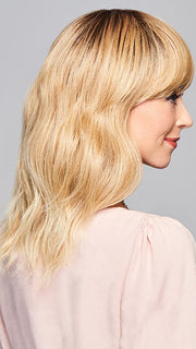 Model is wearing ASPIRATION by GABOR in color SS-LIGHT-BLONDE | Light Blonde with Golden Highlights & Dark Brown Roots